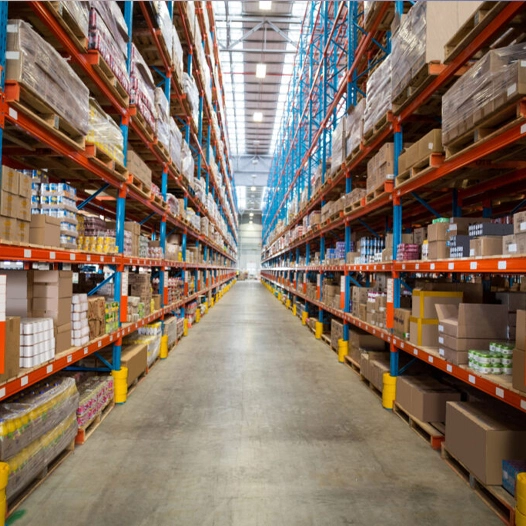 Spacious warehouse interior with neatly organized shelves full of goods, highlighting efficient storage solutions